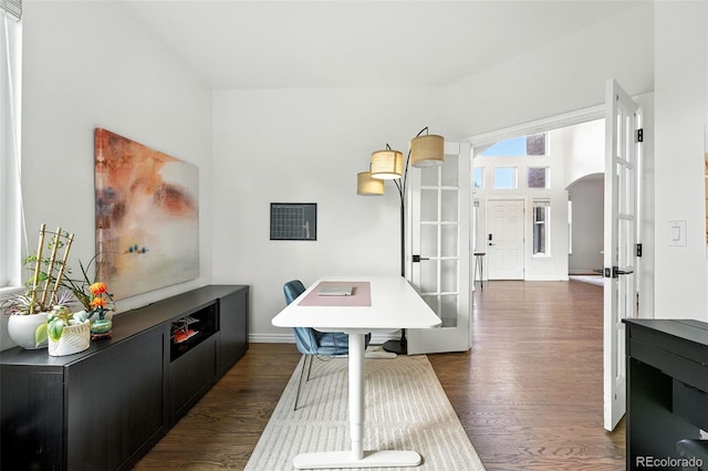 5731 S Yampa St, Centennial, CO 80015 - dining space with arched walkways, dark wood-type flooring, and french doors