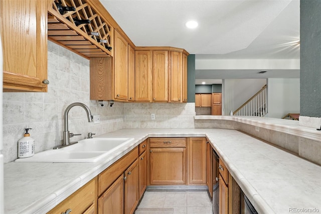 5731 S Yampa St, Centennial, CO 80015 - kitchen with decorative backsplash and light tile patterned floors