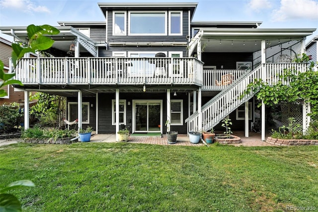 5731 S Yampa St, Centennial, CO 80015 - back of property with a deck, a lawn, and stairs
