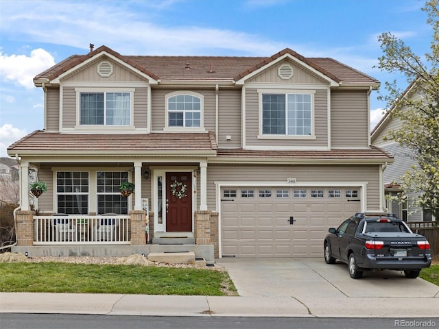 2468 Candleglow St, Castle Rock, CO 80109 - view of front facade featuring a garage, driveway, a porch, and a tile roof