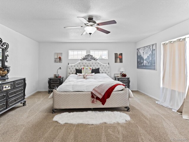 2468 Candleglow St, Castle Rock, CO 80109 - bedroom featuring light carpet, a ceiling fan, baseboards, and a textured ceiling