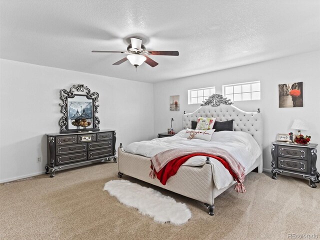 2468 Candleglow St, Castle Rock, CO 80109 - bedroom featuring carpet floors, a textured ceiling, and a ceiling fan