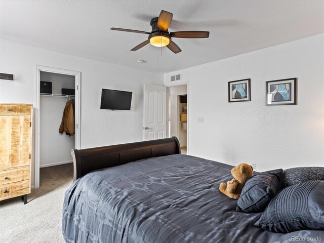 2468 Candleglow St, Castle Rock, CO 80109 - bedroom featuring carpet floors, a walk in closet, a ceiling fan, a closet, and baseboards