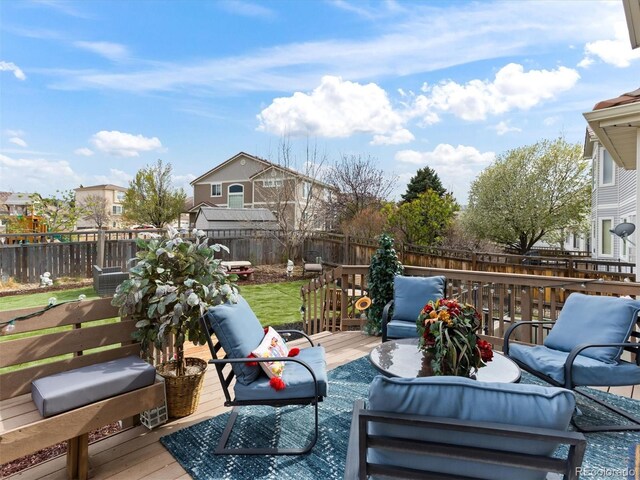 2468 Candleglow St, Castle Rock, CO 80109 - wooden terrace with outdoor lounge area and a fenced backyard
