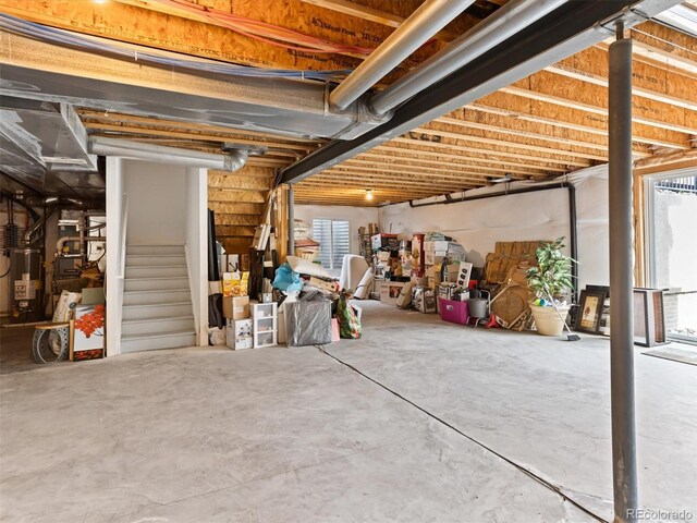 2468 Candleglow St, Castle Rock, CO 80109 - below grade area featuring stairway and gas water heater