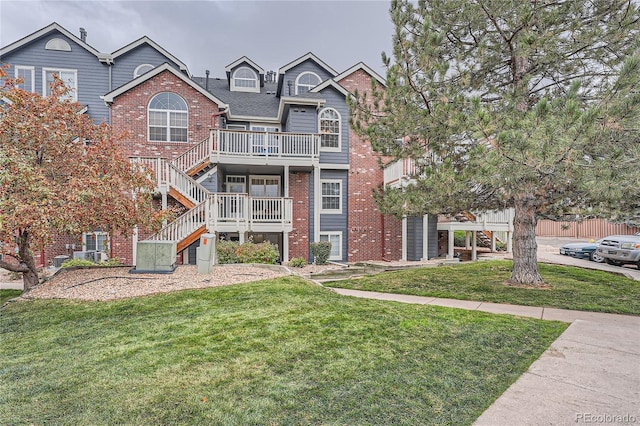 view of front of property with a front lawn and a deck