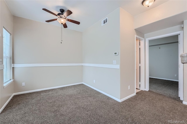 carpeted empty room with ceiling fan