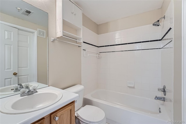 full bathroom with vanity, toilet, and tiled shower / bath