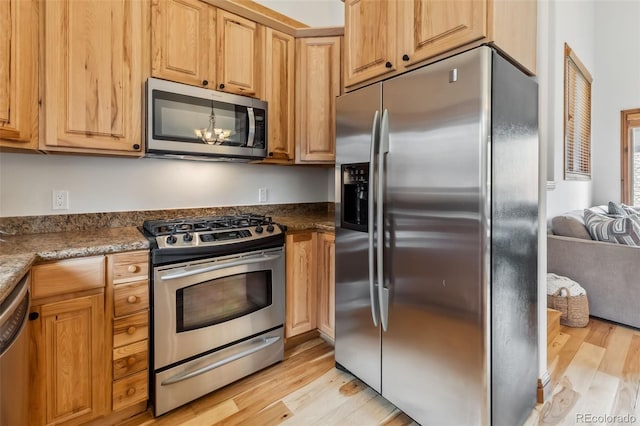 1152 Ski Hill Rd, Breckenridge, CO 80424 - kitchen with stainless steel appliances and light wood-type flooring