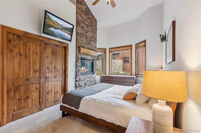 1152 Ski Hill Rd, Breckenridge, CO 80424 - bedroom with high vaulted ceiling, a fireplace, a ceiling fan, and carpet floors