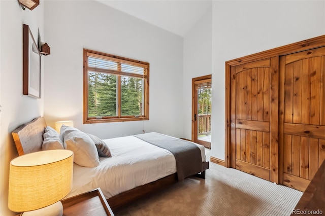 1152 Ski Hill Rd, Breckenridge, CO 80424 - bedroom with access to outside, multiple windows, and lofted ceiling