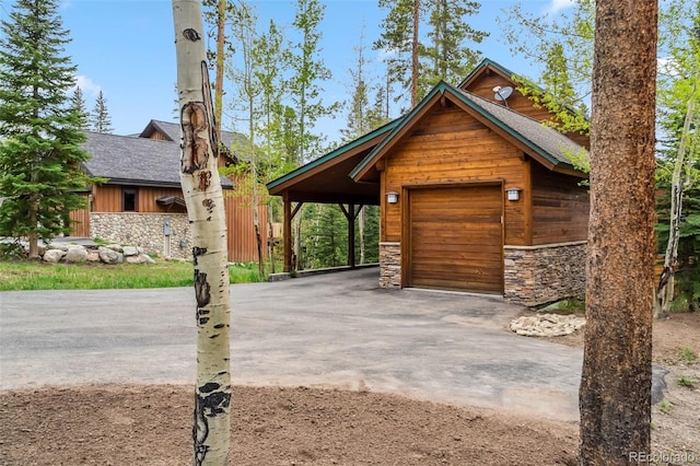 1152 Ski Hill Rd, Breckenridge, CO 80424 - garage featuring asphalt driveway and a detached garage