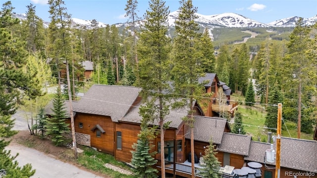1152 Ski Hill Rd, Breckenridge, CO 80424 - view of side of property with roof with shingles, a mountain view, and a view of trees