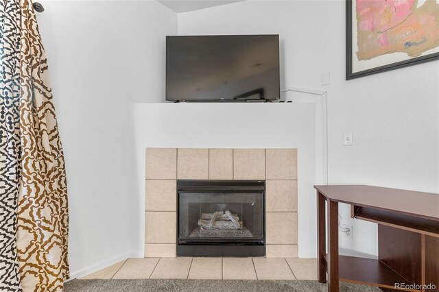 details featuring a fireplace and tile patterned floors