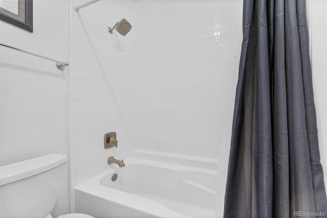 bathroom with toilet and shower / bath combination with curtain