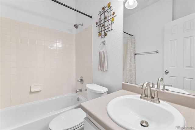 full bathroom with vanity, shower / bathtub combination with curtain, and toilet