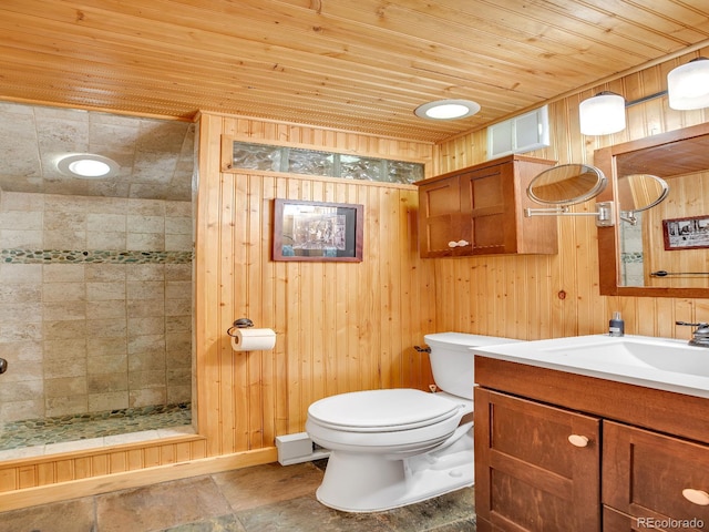 1000 Lodgepole Dr, Evergreen, CO 80439 - bathroom with a shower stall, vanity, wooden ceiling, wooden walls, and stone finish flooring