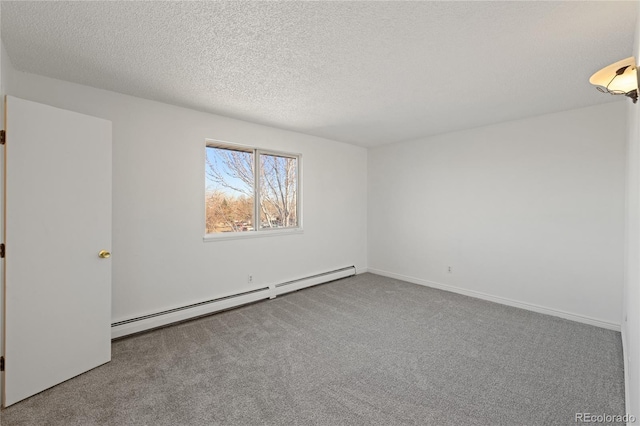 carpeted spare room featuring a textured ceiling, baseboards, and a baseboard radiator