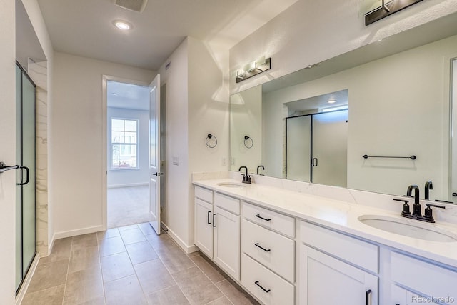 full bath with a sink and a stall shower