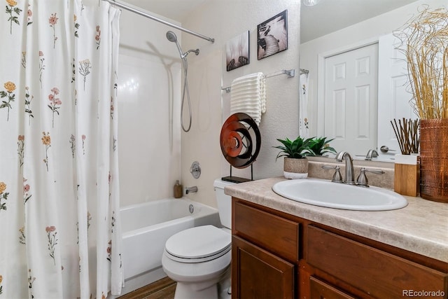 full bathroom featuring toilet, shower / tub combo, and vanity