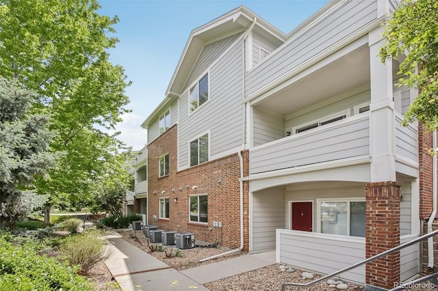 10129 W 55th Dr Unit 3, Arvada, CO 80002 - view of home's exterior with brick siding and cooling unit