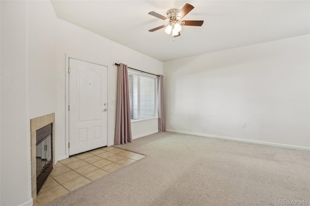 10129 W 55th Dr Unit 3, Arvada, CO 80002 - foyer featuring light colored carpet, ceiling fan, a tiled fireplace, and baseboards