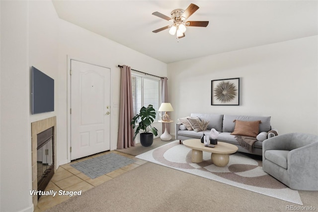 10129 W 55th Dr Unit 3, Arvada, CO 80002 - carpeted living area with a tile fireplace, ceiling fan, and tile patterned floors