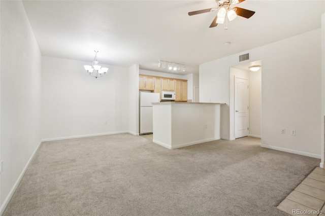 10129 W 55th Dr Unit 3, Arvada, CO 80002 - unfurnished living room featuring a chandelier, light carpet, ceiling fan, and baseboards