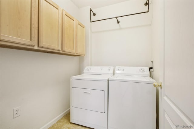 10129 W 55th Dr Unit 3, Arvada, CO 80002 - washroom with cabinet space, washer and dryer, and light tile patterned flooring