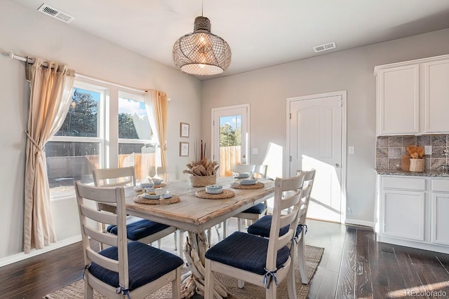 dining area featuring dark hardwood / wood-style floors