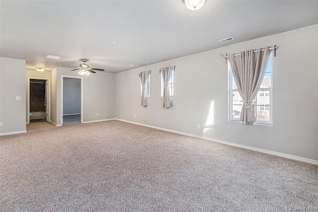 carpeted empty room with ceiling fan