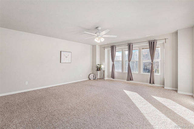 carpeted empty room with ceiling fan