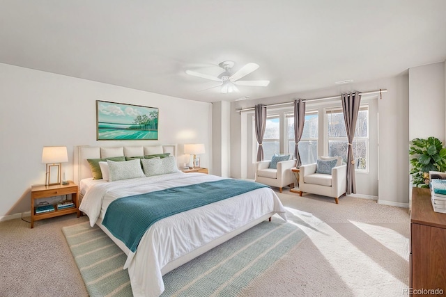 bedroom featuring ceiling fan and light carpet