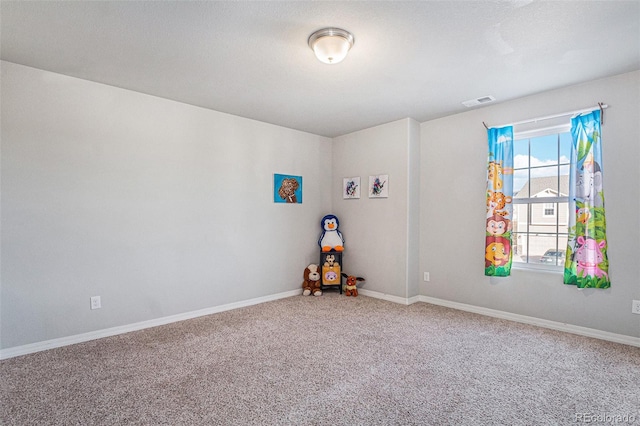 unfurnished room featuring carpet flooring