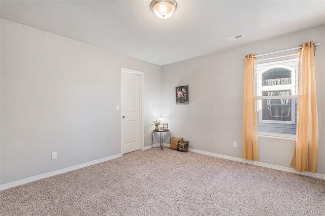 empty room featuring carpet flooring