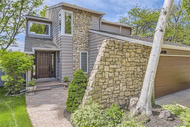 1540 W Briarwood Ave, Littleton, CO 80120 - view of front of house featuring stone siding and a garage