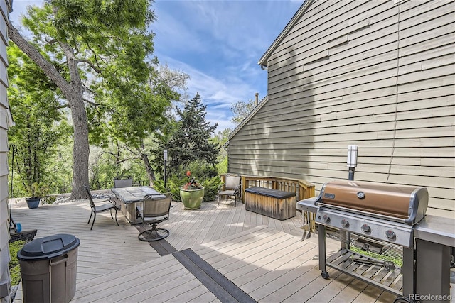 1540 W Briarwood Ave, Littleton, CO 80120 - wooden deck with outdoor dining area and a grill