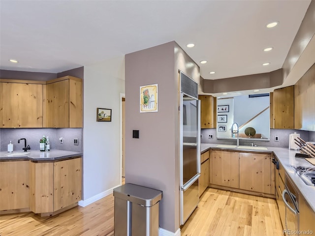 1540 W Briarwood Ave, Littleton, CO 80120 - kitchen featuring wall oven, light brown cabinets, light wood finished floors, a sink, and recessed lighting