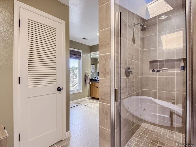 1540 W Briarwood Ave, Littleton, CO 80120 - full bathroom with a shower stall, tile patterned flooring, baseboards, and vanity