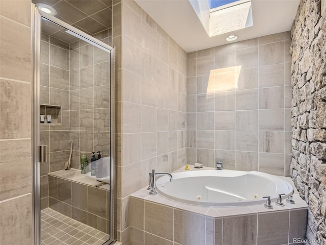 1540 W Briarwood Ave, Littleton, CO 80120 - bathroom with a tub with jets, a stall shower, a skylight, and tile walls