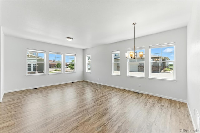 15501 E 112th Ave Unit 6F, Commerce City, CO 80022 - unfurnished room with a chandelier and wood finished floors