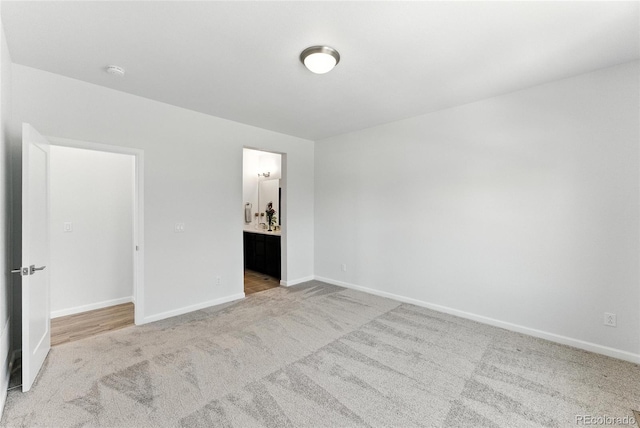 15501 E 112th Ave Unit 6F, Commerce City, CO 80022 - unfurnished bedroom with light colored carpet and ensuite bath