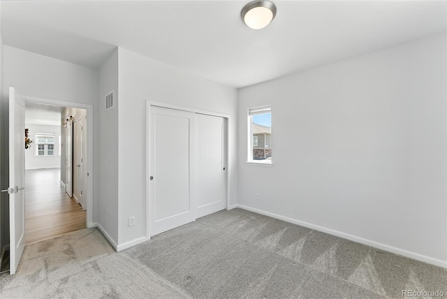 15501 E 112th Ave Unit 6F, Commerce City, CO 80022 - unfurnished bedroom with carpet flooring and a closet