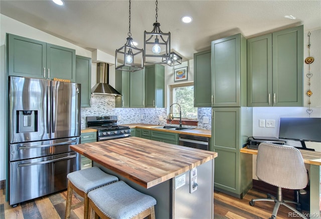 61 Country Sky Ln, Estes Park, CO 80517 - kitchen with green cabinets, wood counters, stainless steel appliances, wall chimney exhaust hood, and lofted ceiling