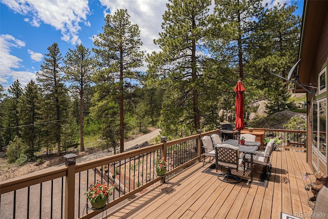 61 Country Sky Ln, Estes Park, CO 80517 - wooden deck featuring outdoor dining space