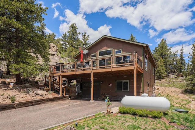 61 Country Sky Ln, Estes Park, CO 80517 - view of front of property with a deck and a chimney