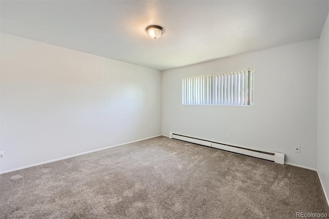 carpeted spare room with baseboard heating