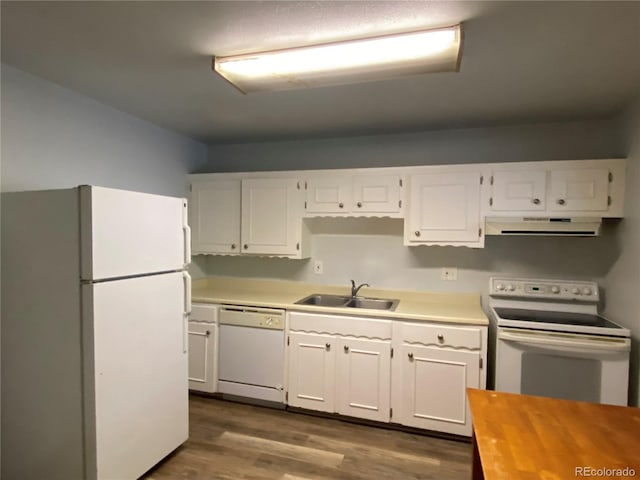 kitchen featuring range hood, white appliances, white cabinetry, sink, and dark hardwood / wood-style floors