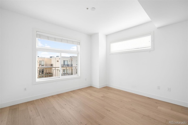3301 Arapahoe Ave Unit 411, Boulder, CO 80303 - empty room featuring plenty of natural light and light wood finished floors
