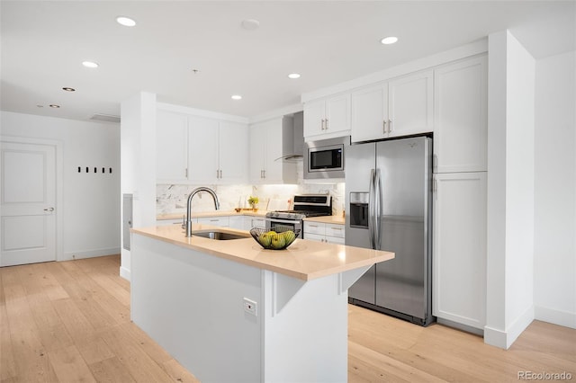 3301 Arapahoe Ave Unit 411, Boulder, CO 80303 - kitchen featuring appliances with stainless steel finishes, light countertops, light wood-style floors, recessed lighting, and white cabinets